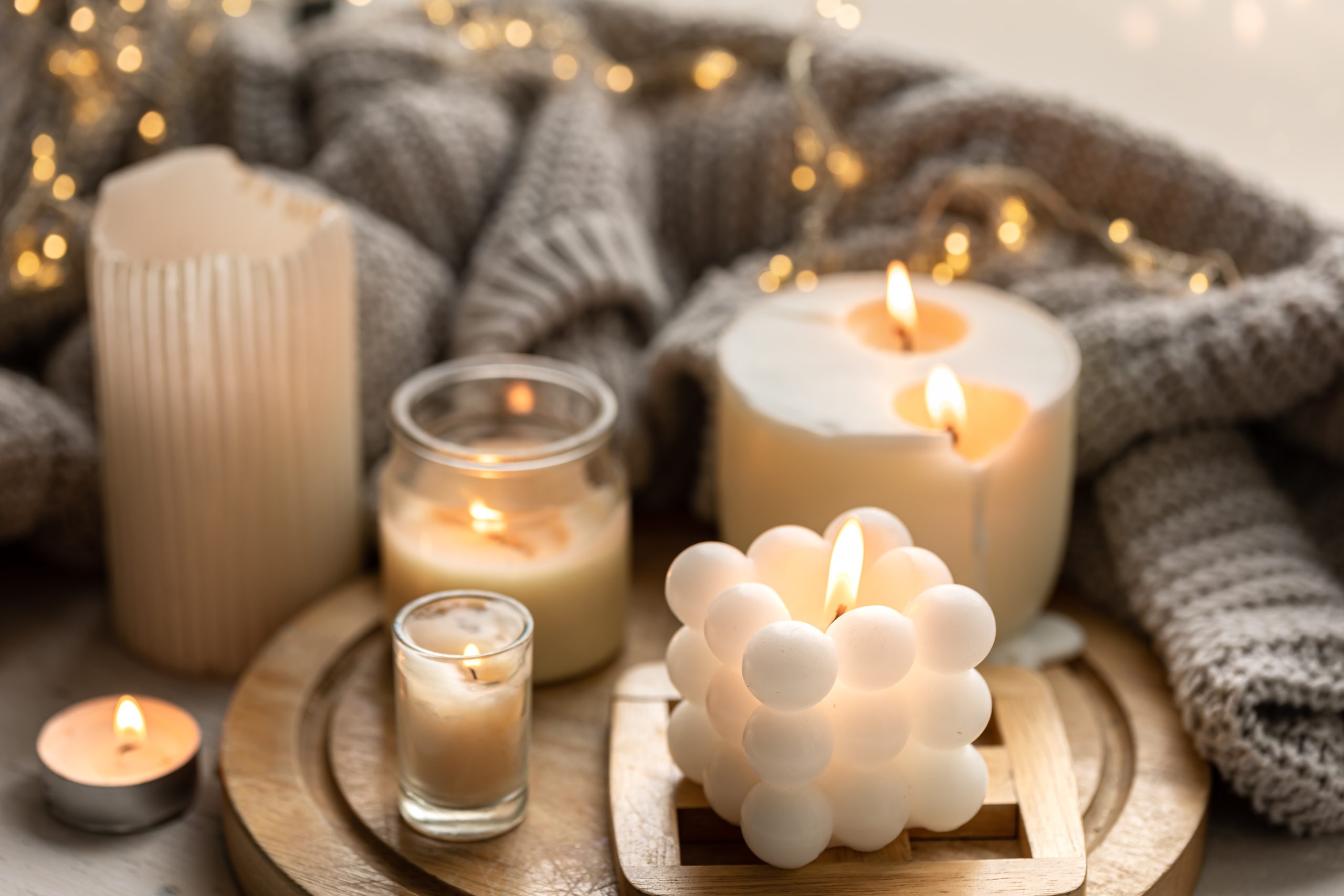 cozy composition with candles knitted element garland 1 scaled